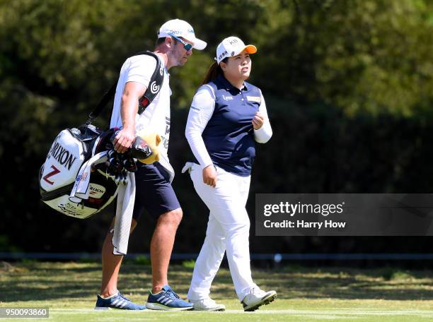 Inbee Park of South Korea and her caddie walk on the sixth fairway during round four of the Hugel-JTBC Championship at the Wilshire Country Club on...