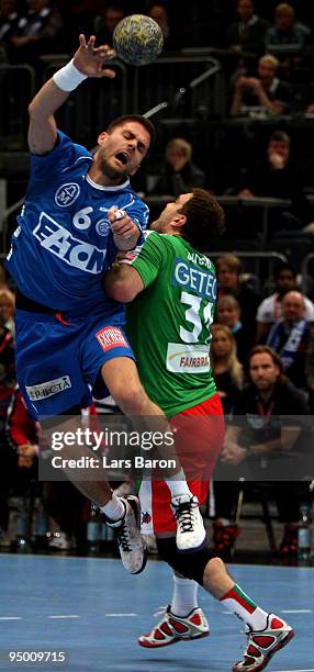 Drago Vukovic of Gummersbach is challenged by Bartosz Jurecki of Magdeburg during the Toyota Handball Bundesliga match between VfL Gummersbach and SC...