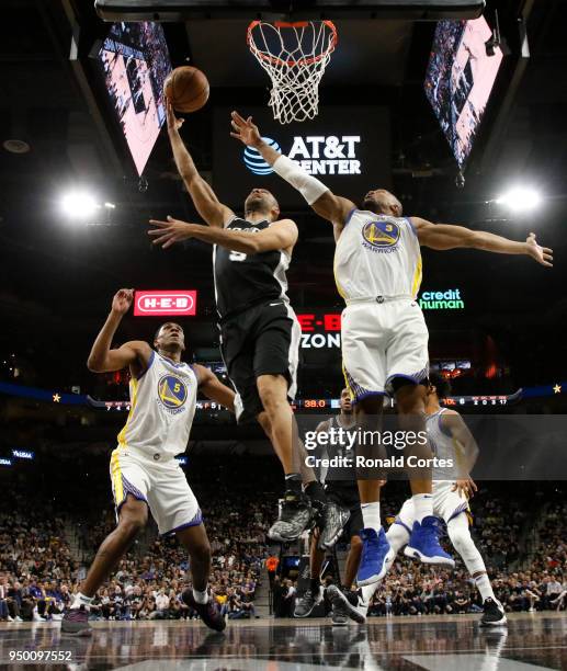 Tony Parker of the San Antonio Spurs drives past David West of the Golden State Warriors in the first half of Game Four of Round One of the 2018 NBA...