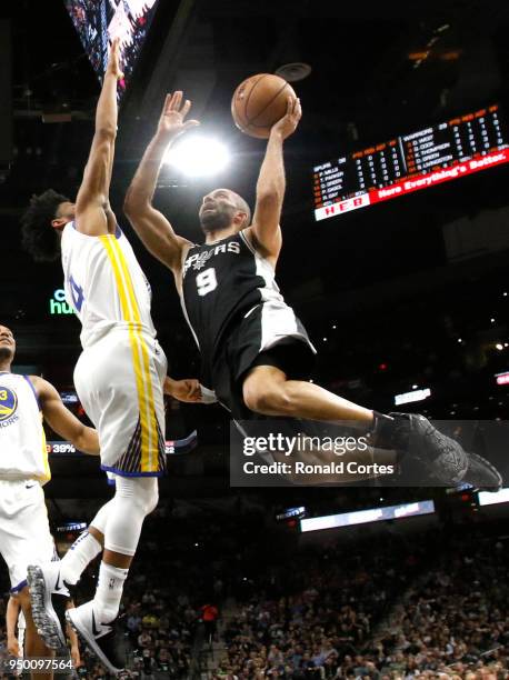 Tony Parker of the San Antonio Spurs drives past Quinn Cook of the Golden State Warriors in the first half of Game Four of Round One of the 2018 NBA...