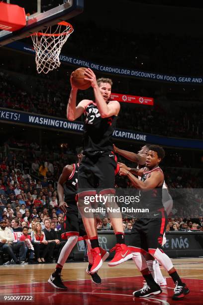 Jakob Poeltl of the Toronto Raptors grabs the rebound against the Washington Wizards in Game Four of Round One of the 2018 NBA Playoffs on April 22,...