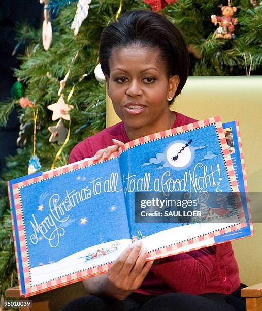 First Lady Michelle Obama reads "'Twas the Night Before Christmas" to children during a visit to the Children�s National Medical Center in...