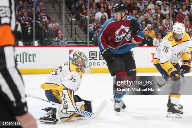 Goaltender Pekka Rinne of the Nashville Predators makes a save against Mikko Rantanen of the Colorado Avalanche in Game Six of the Western Conference...