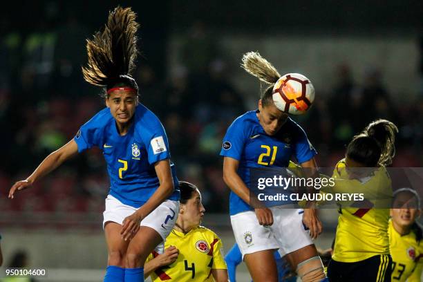 Brazil's player Monica Hickmann heads the ball to score against Colombia during the women's Copa America match at La Portada stadium in Serena,...