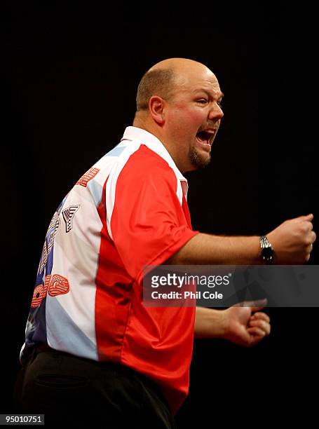 Darin Young of the USA celebrates beating Andy Smith of England during the 2010 Ladbrokes.com World Darts Championship Round One at Alexandra Palace...