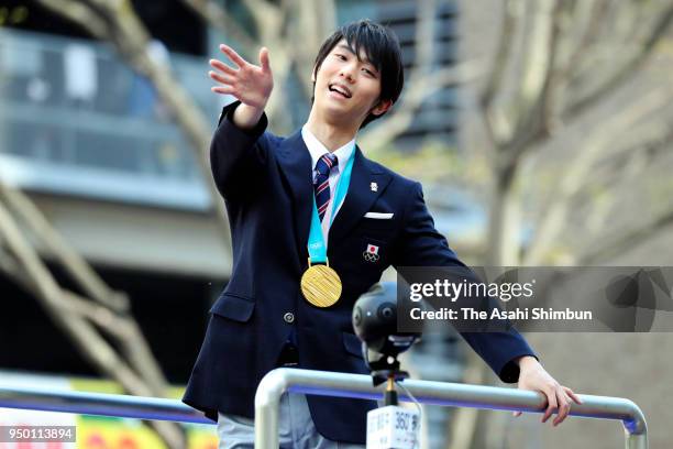 Sochi and PyeongChang Winter Olympic Games Figure Skating Men's Single gold medalist Yuzuru Hanyu waves to supporters during the parade on April 22,...