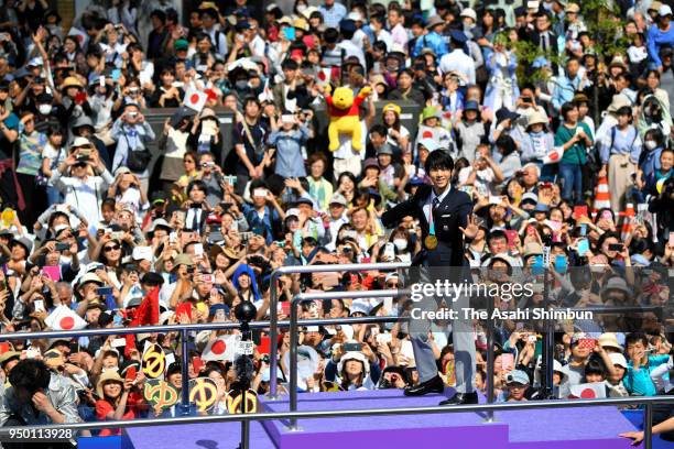 Sochi and PyeongChang Winter Olympic Games Figure Skating Men's Single gold medalist Yuzuru Hanyu waves to supporters during the parade on April 22,...