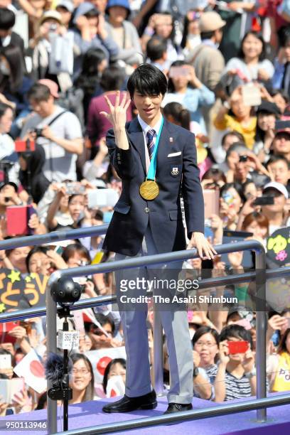 Sochi and PyeongChang Winter Olympic Games Figure Skating Men's Single gold medalist Yuzuru Hanyu waves to supporters during the parade on April 22,...