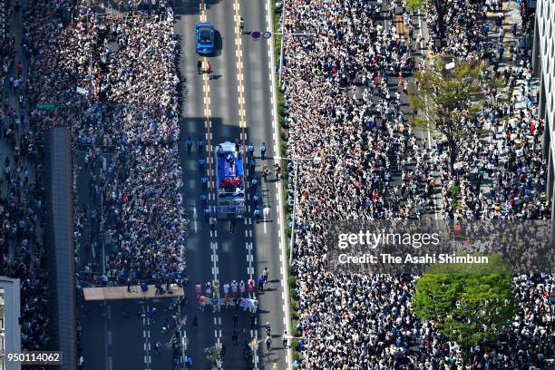 In this aerial image, people cheer Sochi and PyeongChang Winter Olympic Games Figure Skating Men's Single gold medalist Yuzuru Hanyu during the...