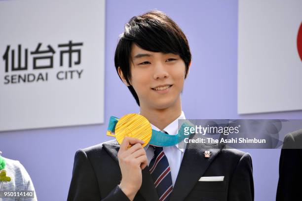 Sochi and PyeongChang Winter Olympic Games Figure Skating Men's Single gold medalist Yuzuru Hanyu poses for photographs during the parade on April...