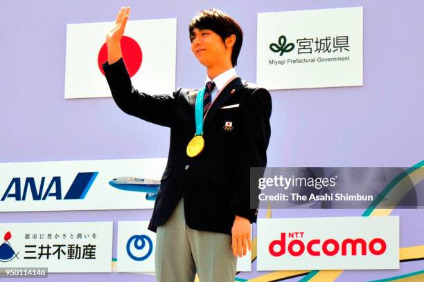 Sochi and PyeongChang Winter Olympic Games Figure Skating Men's Single gold medalist Yuzuru Hanyu waves during the parade on April 22, 2018 in...