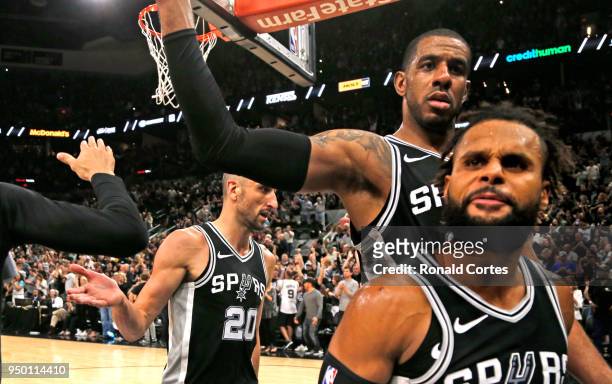 Manu Ginobili, LaMarcus Aldridge and Patty Mills of the San Antonio Spurs celebrate after winning Game Four of Round One of the 2018 NBA Playoffs...