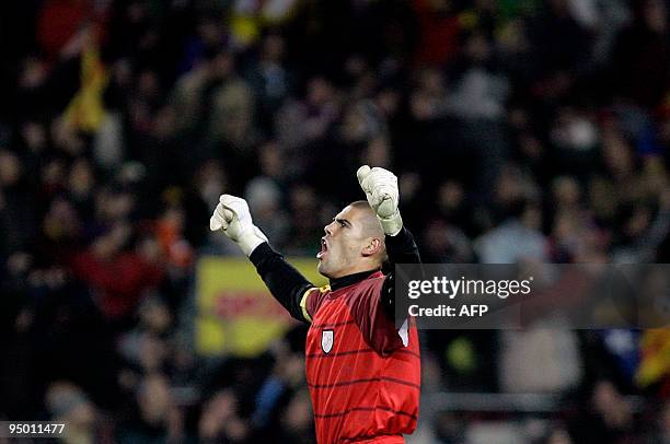 Catalonia's goalkeeper Victor Valdes reacts after the goal by his team-mate Sergio Garcia during a friendly football match between Catalonia National...