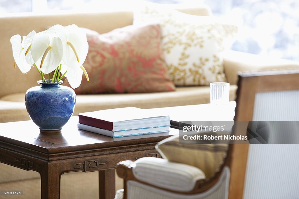 Anthuriums in vase on coffee table