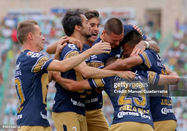 Marcelo Diaz of Pumas celebrates with teammates after scoring the first goal of his team during the 16th round match between Santos Laguna and Pumas...