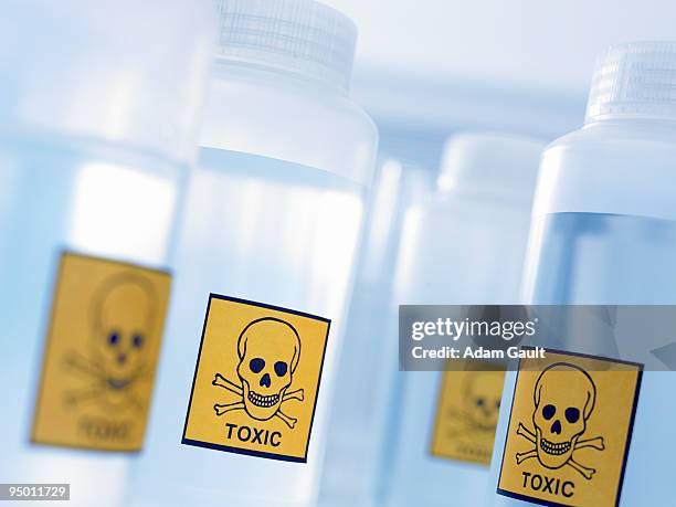 bottles with toxic labels - sostanza tossica foto e immagini stock