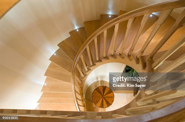 spiraling wooden staircase - wooden staircase stock pictures, royalty-free photos & images