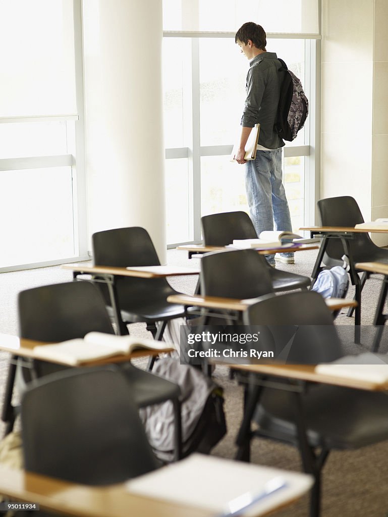 Window Alone Student College Student Looking Out Classroom Window High-Res Stock Photo ...