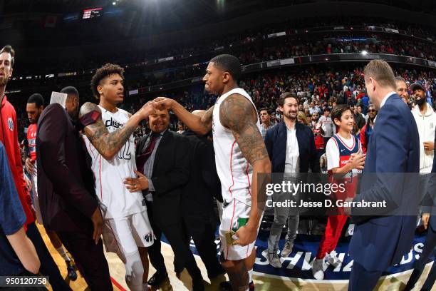 Otto Porter Jr. #22 and Bradley Beal of the Washington Wizards exchange a handshake after Game Four of Round One of the 2018 NBA Playoffs against the...