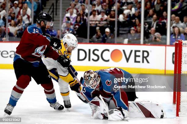 Patrik Nemeth and goalie Andrew Hammond of the Colorado Avalanche prevent a shot on goal by Viktor Arvidsson of the Nashville Predators in Game Six...