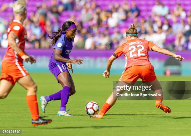 Orlando Pride forward Chioma Ubogagu looks to shoot on goal as Houston Dash defender Amber Brooks defends during the NWSL soccer match between the...