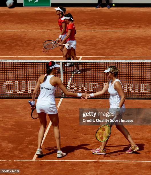 Georgina Garcia and Maria Jose Martinez of Spain celebrates a point in their doubles match against Montserrat Gonzalez and Veronica Cepede of...