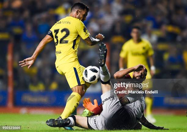 Carlos Tevez of Boca Juniors fights for the ball with Nelson Ibáñez of Newells Old Boys during a match between Boca Juniors and Newell's Old Boys as...