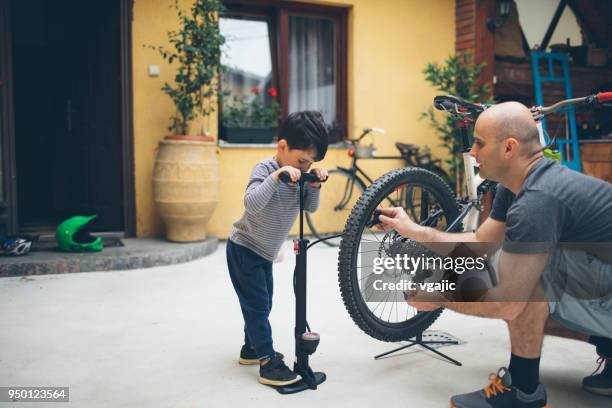 father and son at home - inflating stock pictures, royalty-free photos & images