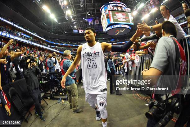 Otto Porter Jr. #22 of the Washington Wizards exchanges high fives with fans as he exits the arena after Game Four of Round One of the 2018 NBA...