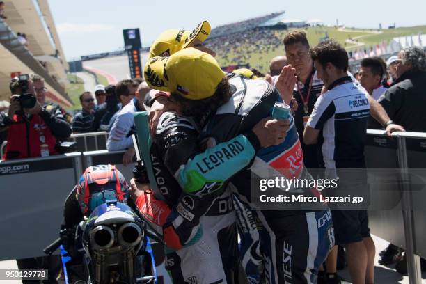 Marco Bezzecchi of Italy and Pruestel GP KTM hugs Enea Bastianini of Italy and Leopard Racing and celebrates under the podium at the end of the Moto3...