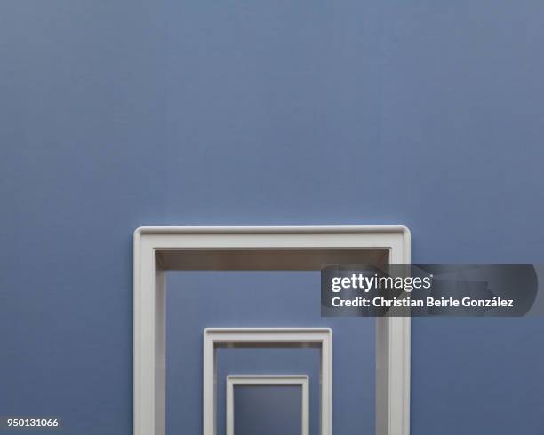 white doorframes on blue wall - christian beirle fotografías e imágenes de stock