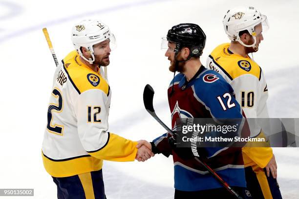 Mike Fisher of the Nashville Predators is congratulated by Patrik Nemeth of the Colorado Avalanche after the Predators win in Game Six of the Western...