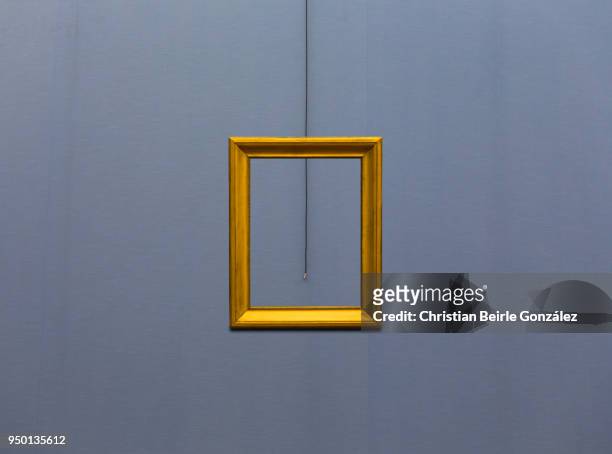 empty frame on blue wall - christian beirle gonzález stock-fotos und bilder