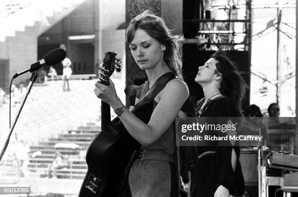 Nancy and Ann Wilson of Heart perform live at The Oakland Coliseum in 1977 in Oakland, California.