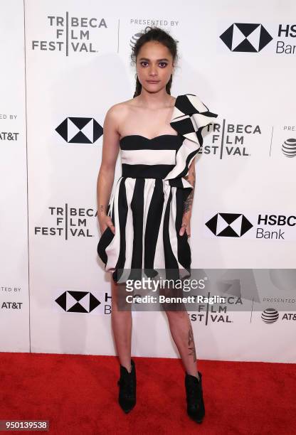 Actress Sasha Lane poses for a picture on the red carpet during the 2018 Tribeca Film Festival screening of "The Miseducation Of Cameron Post" at...