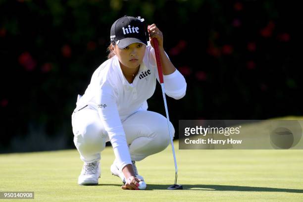 Jin Young Ko of South Korea lines up her putt on the 14th green during round four of the Hugel-JTBC LA Open at the Wilshire Country Club on April 22,...