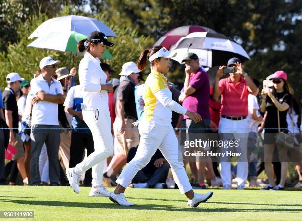 Moriya Jutanugarn of Thailand and Jin Young Ko of South Korea walk to the 15th fairway during round four of the Hugel-JTBC LA Open at the Wilshire...