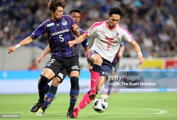 Kenyu Sugimoto of Cerezo Osaka and Genta Miura of Gamba Osaka compete for the ball during the J.League J1 match between Gamba Osaka and Cerezo Osaka...