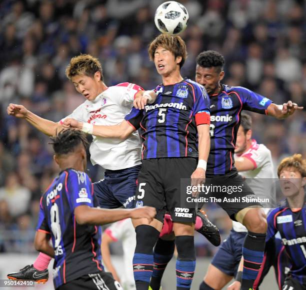 Genta Miura of Gamba Osaka and Yoichiro Kakitani of Cerezo Osaka compete for the ball during the J.League J1 match between Gamba Osaka and Cerezo...