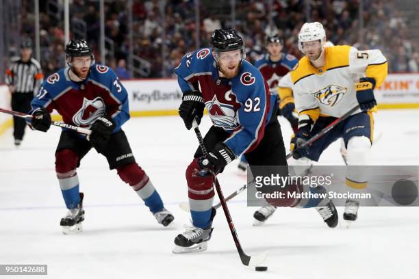 Gabriel Landeskog of the Colorado Avalanche advances the puck against the Nashville Predators in Game Six of the Western Conference First Round...