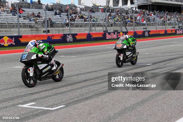 John McPhee of Great Britain and CIP Green Power KTM leads Makar Yurchenko of Kazakhstan and CIP Green Power KTM during the Moto3 race during the...