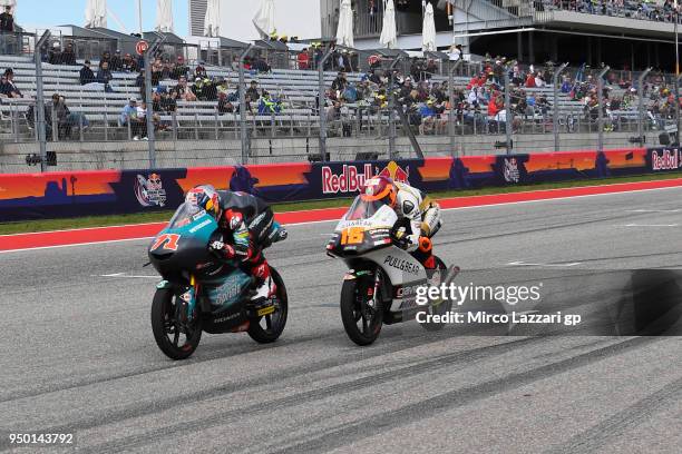 Ayumu Sasaki of Japan and Petronas Sprinta Racing leads Andrea Migno of Italy and Angel Nieto Team Moto3 KTM during the Moto3 race during the MotoGp...