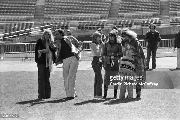 Promoter Bill Graham chats with Stevie Nicks of Fleetwood Mac at The Oakland Coliseum in 1977 in Oakland, California.