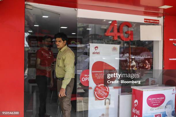 Customer exits a Bharti Airtel Ltd. Store in Mumbai, India, on Saturday, April 21, 2018. Bharti Airtel are scheduled to release earnings on April 24....