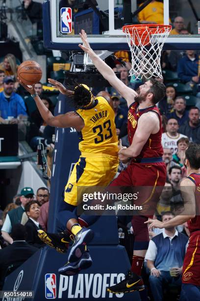 Kevin Love of the Cleveland Cavaliers defends against Myles Turner of the Indiana Pacers in the second half of game four of the NBA Playoffs at...