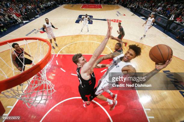 Kelly Oubre Jr. #12 of the Washington Wizards goes to the basket against the Toronto Raptors in Game Four of Round One of the 2018 NBA Playoffs on...