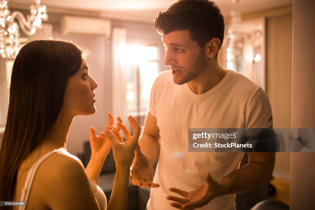 Young couple having disscusion at home