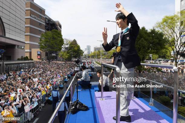 Sochi and PyeongChang Winter Olympic Games Figure Skating Men's Single gold medalist Yuzuru Hanyu waves to supporters during the parade on April 22,...