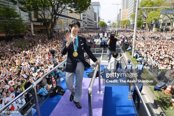 Sochi and PyeongChang Winter Olympic Games Figure Skating Men's Single gold medalist Yuzuru Hanyu waves to supporters during the parade on April 22,...