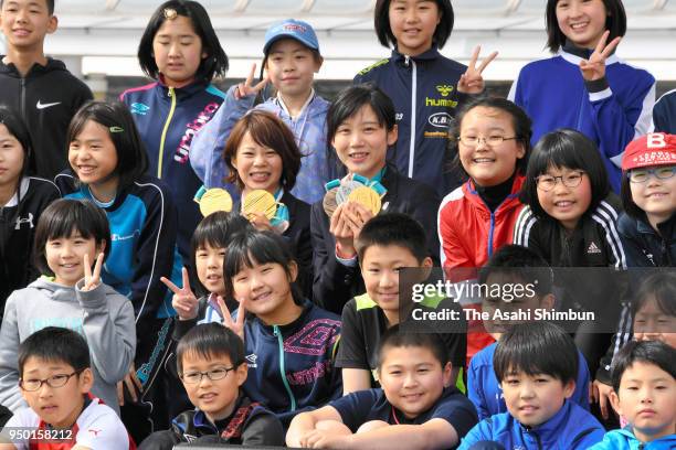 PyeongChang Winter Olympic medalists Nana and Miho Takagi pose for photographs during the parade on April 22, 2018 in Makubetsu, Hokkaido, Japan.